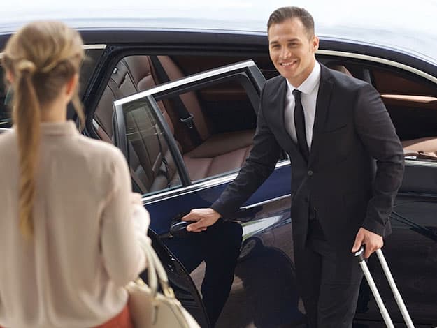 Professional black car providing airport transportation service arriving at Hartsfield-Jackson Atlanta International Airport